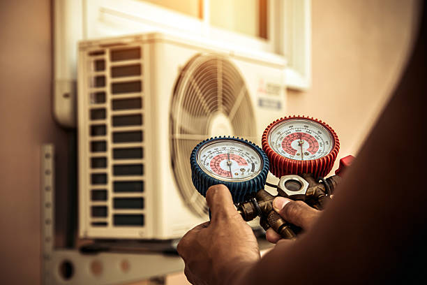 Professional Air Conditioning Service technician working in Clinton, OH